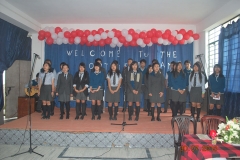 The 12th graders welcome the guests with a song