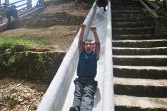 Boy thinks he's the king of the Slide